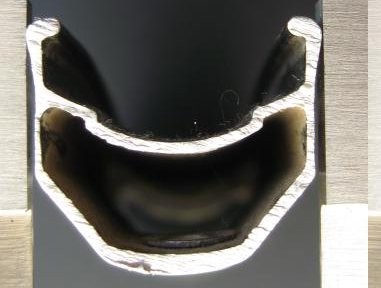 [Rim section showing worn brake track]